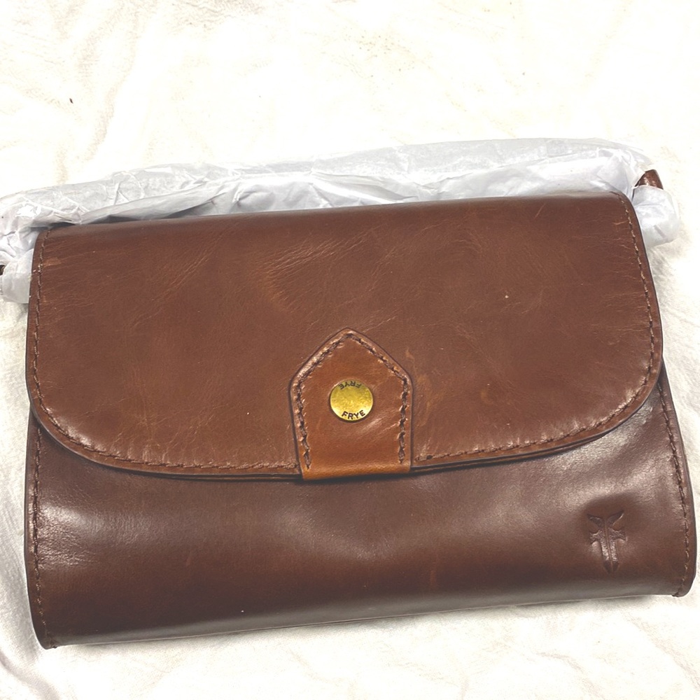 Never used,I received for Christmas but I don’t need it. Tissue paper on strap